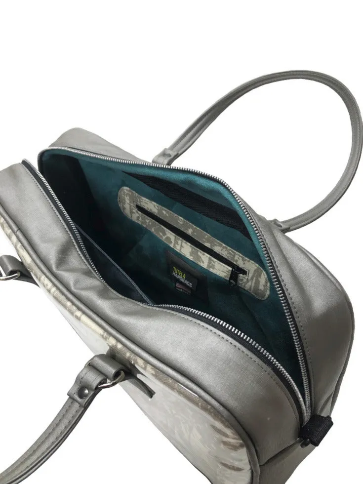 Briefcase in silver trees